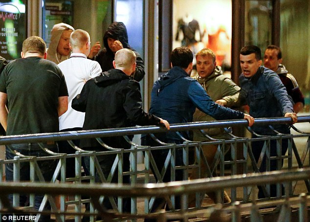 Fresh violence in Lille: Mob of 'Russian ultras' attack English fans as they leave a pub before fl